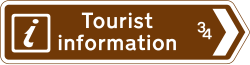 UK sign showing the direction and distance to a tourist information point
