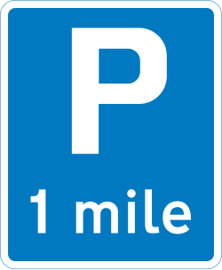 UK information sign showing the distance to a parking place ahead