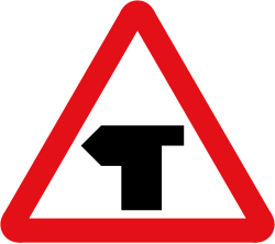 UK T-junction warning sign: a red-bordered triangle with a black T-shaped symbol
