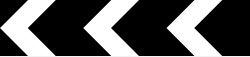 Black board with white chevrons pointing left