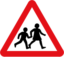UK children warning sign: a red-bordered triangle with two black figures of children walking