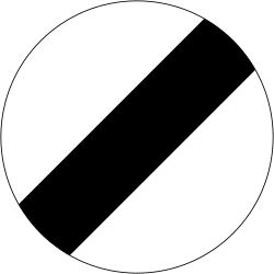 UK national speed limit applies sign: a white circle with a black diagonal stripe