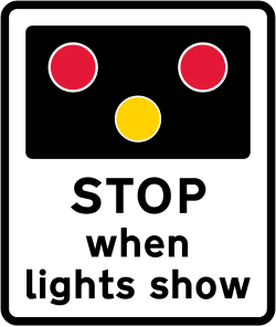 UK warning sign for light signals ahead at a level crossing, swing or lifting bridge or airfield