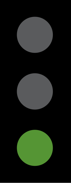 UK traffic signal showing a green light
