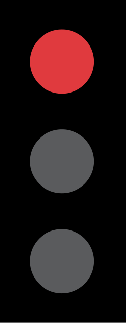UK traffic signal showing a red light